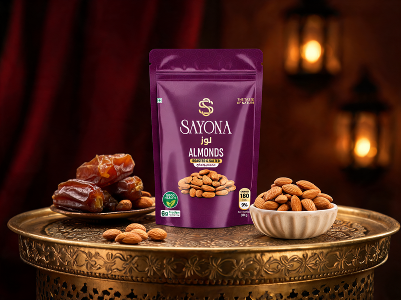 Sayona Almonds pouch on a brass majlis table with almonds and dates